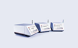 Anton Paar DMA 4101, DMA 4501, and DMA 5001 density meters side by side, each equipped with a syringe and showing digital measurement values.