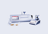 MCP Sucromat polarimeter and Abbemat refractometer with sugar samples and glassware for measuring sugar content, dry substance, and purity.